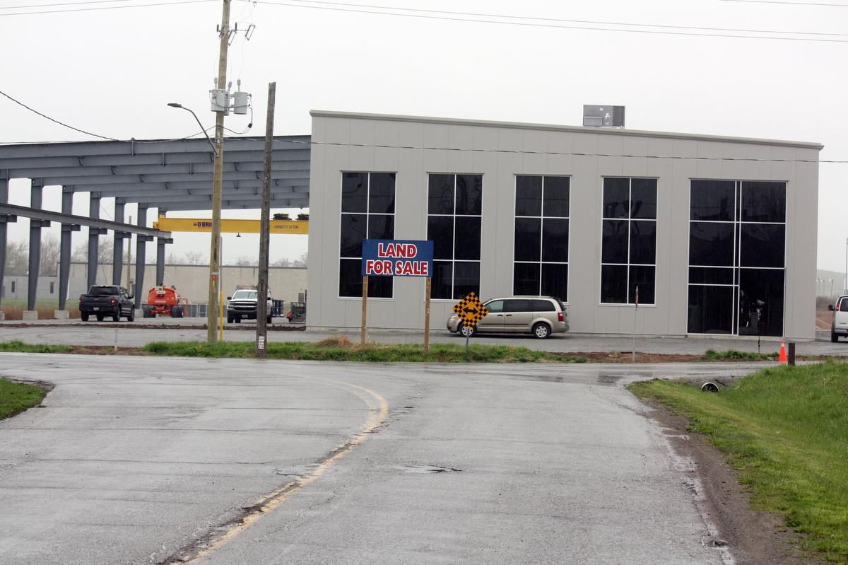 image of factory with a for sale sign