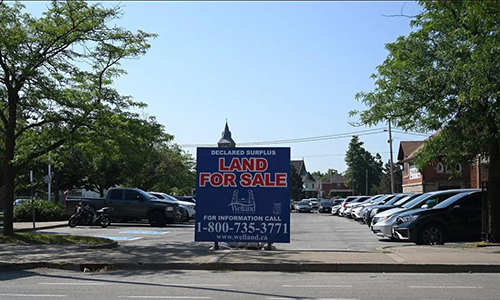 image of for sale sign on parking lot